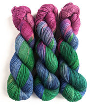 Load image into Gallery viewer, Glow of the Bauble, on superwash merino/yak/nylon sock yarn.
