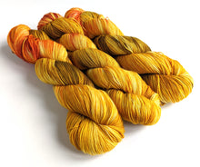 Load image into Gallery viewer, Smaug, on superwash merino/nylon sock yarn.
