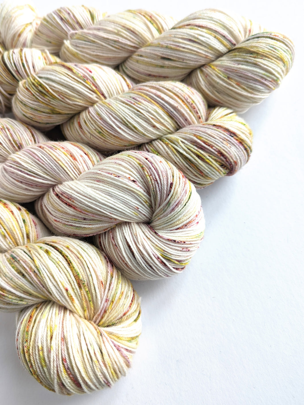 Autumn Speckles on superwash merino/nylon sock yarn.