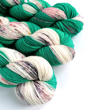 Load image into Gallery viewer, Hand dyed Self-Striping sock yarn on a Superwash Merino/Nylon base in green and speckles. freeshipping - Felt Fusion
