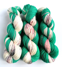 Load image into Gallery viewer, Hand dyed Self-Striping sock yarn on a Superwash Merino/Nylon base in green and speckles. freeshipping - Felt Fusion
