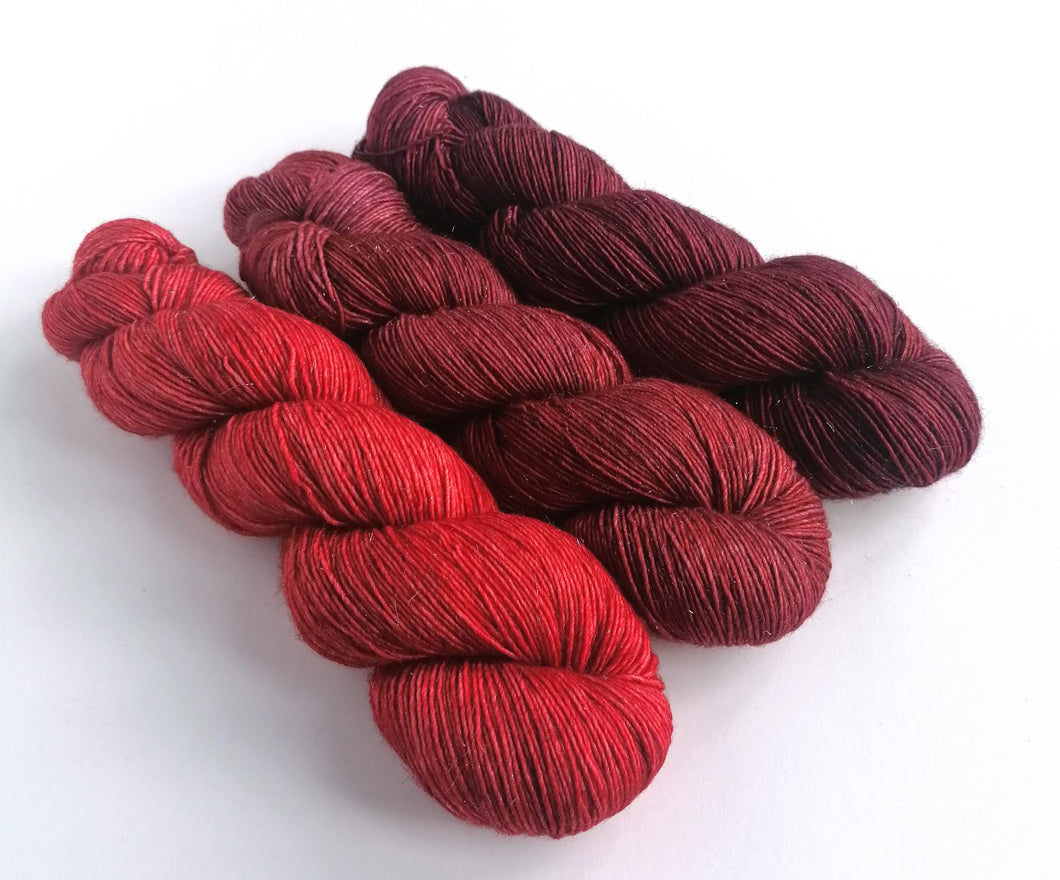 Hand dyed red gradient set on superwash merino/sparkle singles 4ply/fingering weight. freeshipping - Felt Fusion